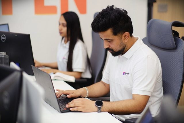 Swyft team members working at their desks