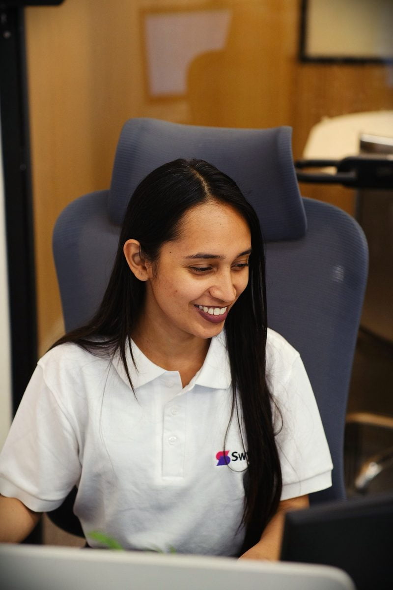 A Swyft team member at her desk in our Mohali office